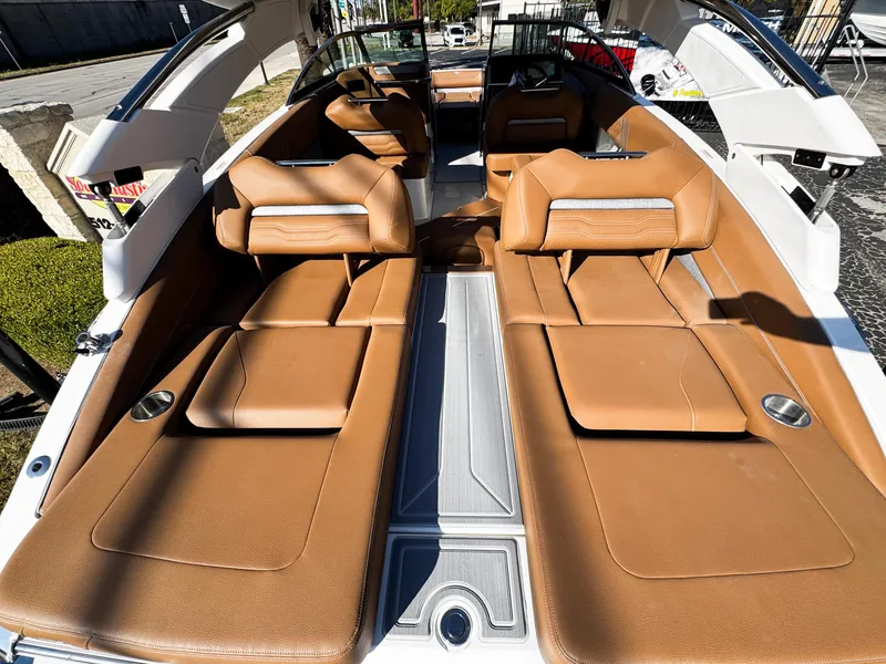 Slide: The Image of 2025 Regal LS6 boat interior with tan leather seating and modern design. - 11