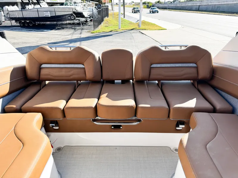 Slide: The Image of 2025 Regal LS6 boat with luxurious brown leather seating. - 13