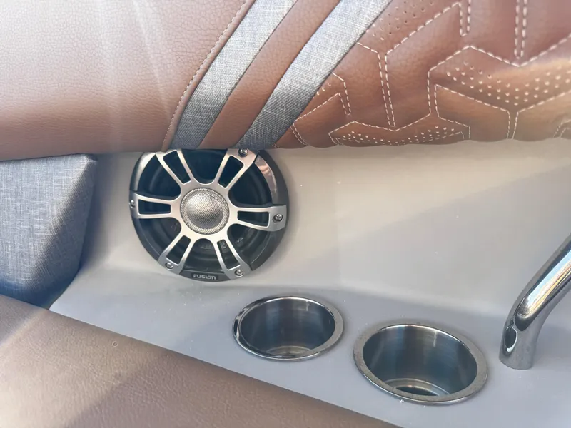 Slide: The Image of 2025 Regal LS6 interior with speaker and cup holders, featuring brown leather upholstery. - 21