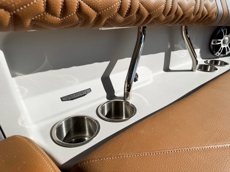 Slide: The Image of 2025 Regal LS6 interior with brown leather seats and stainless steel cup holders. - 22