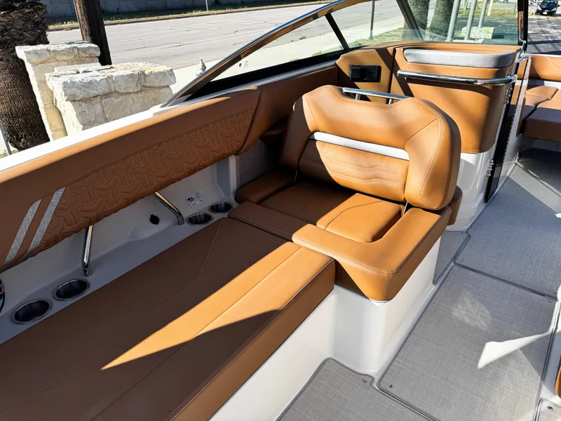 Slide: The Image of Luxurious interior of 2025 Regal LS6 boat with tan leather seating. - 25