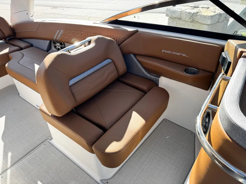 Slide: The Image of Luxurious interior of 2025 Regal LS6 boat with brown leather seating. - 26