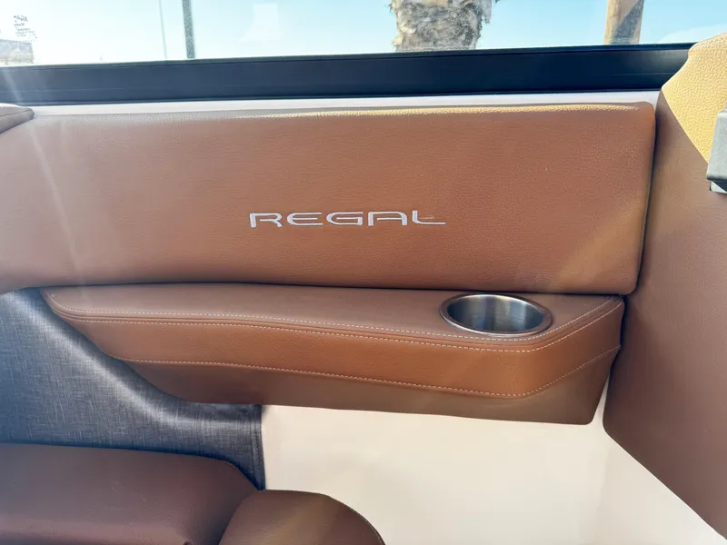 Slide: The Image of 2025 Regal LS6 interior with brown leather and cup holder. - 27