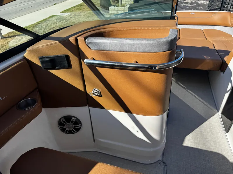 Slide: The Image of Interior of 2025 Regal LS6 boat with brown and gray seating. - 29