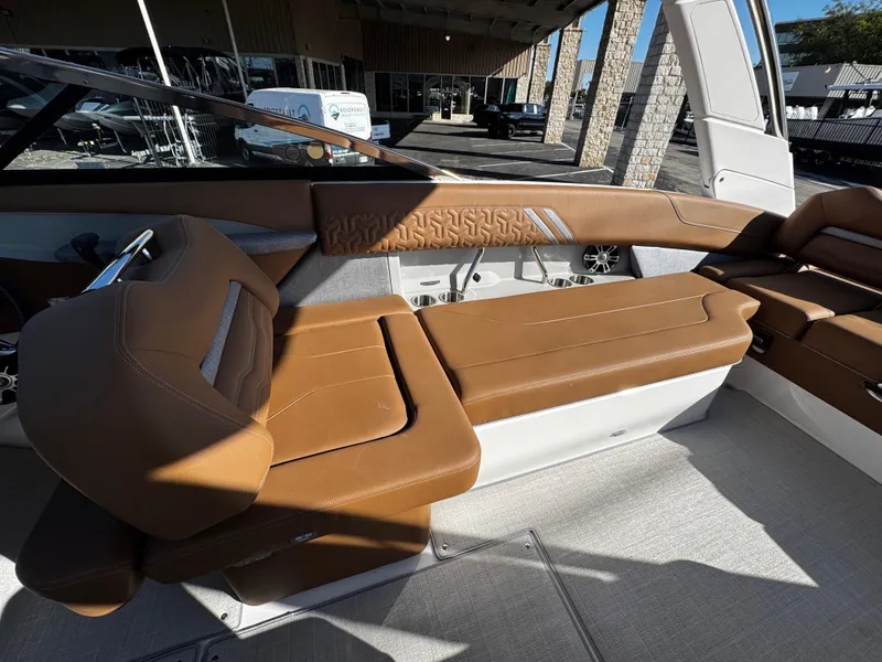 Slide: The Image of 2025 Regal LS6 boat interior with tan leather seating and modern design. - 32