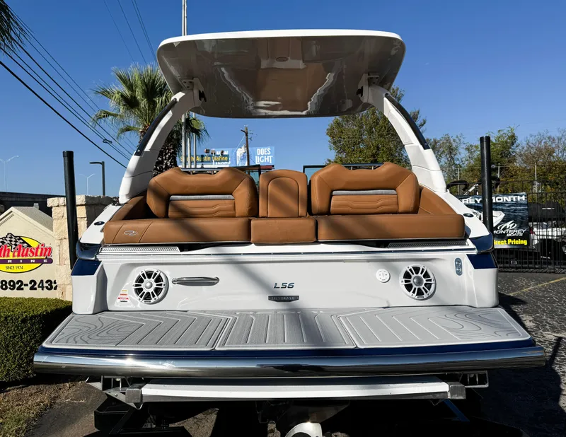 Slide: The Image of 2025 Regal LS6 boat with tan seating and sleek design, rear view. - 4