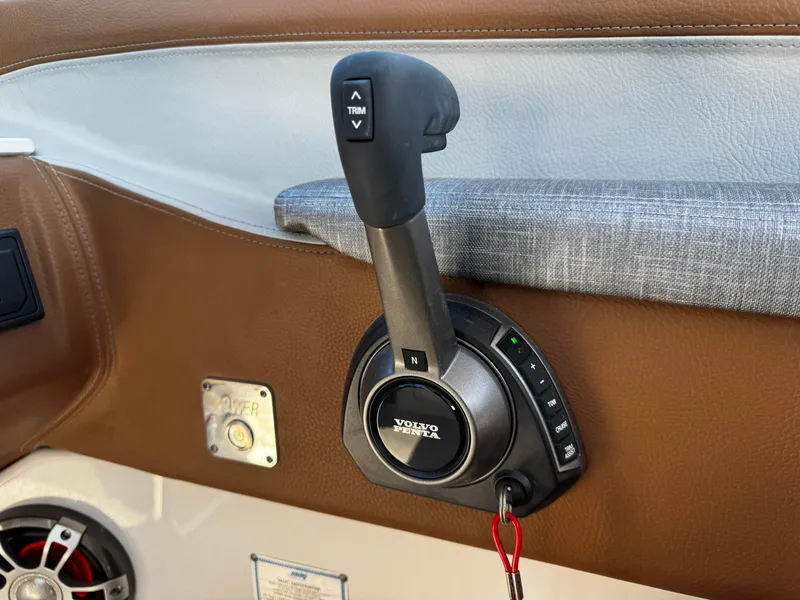 Slide: The Image of Boat throttle control in a 2025 Regal LS6, featuring Volvo Penta branding. - 42