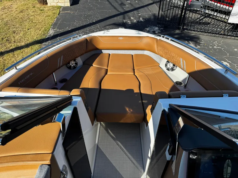Slide: The Image of 2025 Regal LS6 boat interior with tan leather seating and modern design. - 45