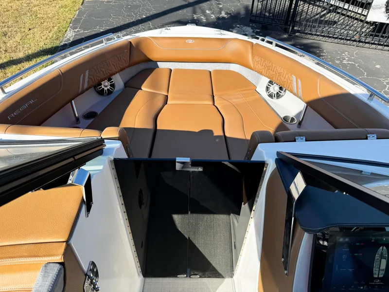 Slide: The Image of 2025 Regal LS6 boat interior with tan leather seating and modern design. - 46