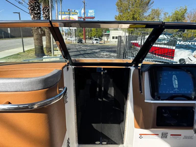 Slide: The Image of Interior view of 2025 Regal LS6 boat with dashboard and open windshield. - 47