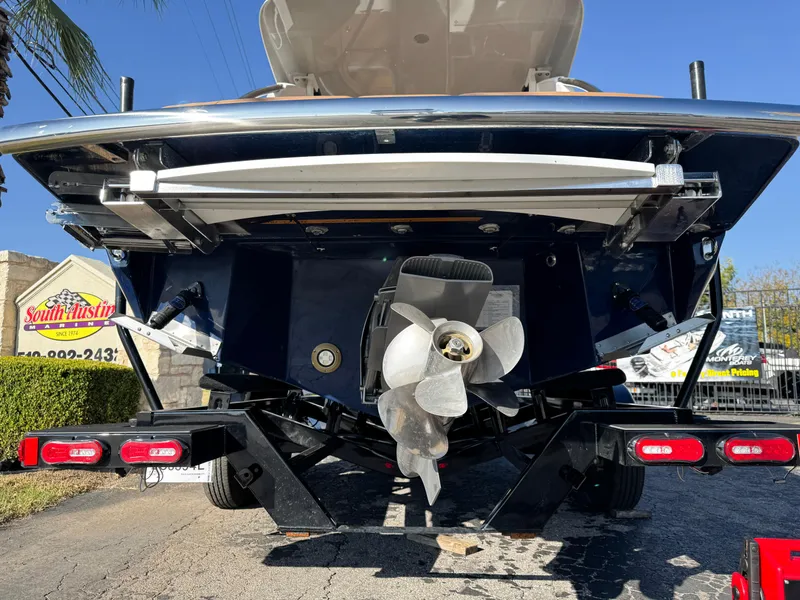 Slide: The Image of Rear view of 2025 Regal LS6 boat with propeller and trailer. - 5