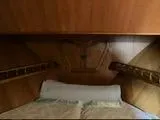 Slide: The Image of Cozy wooden cabin interior of 1977 Davis 42' boat with bed. - 28