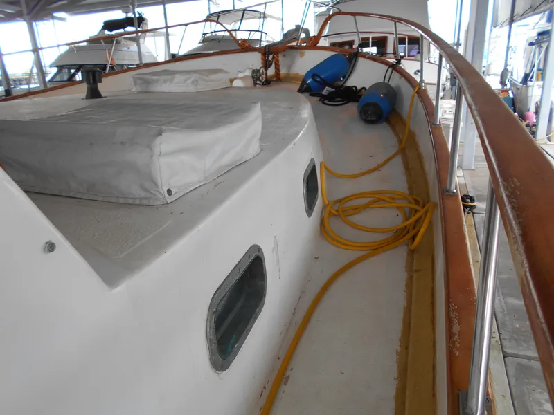 Slide: The Image of 1977 Davis 42' boat deck with equipment and coiled yellow hose. - 3