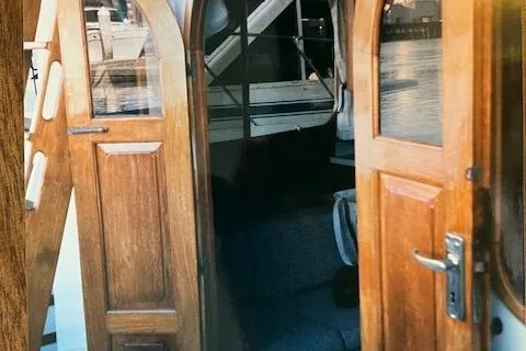 Slide: The Image of Wooden doors on a 1977 Davis 42' boat, open to reveal interior. - 35