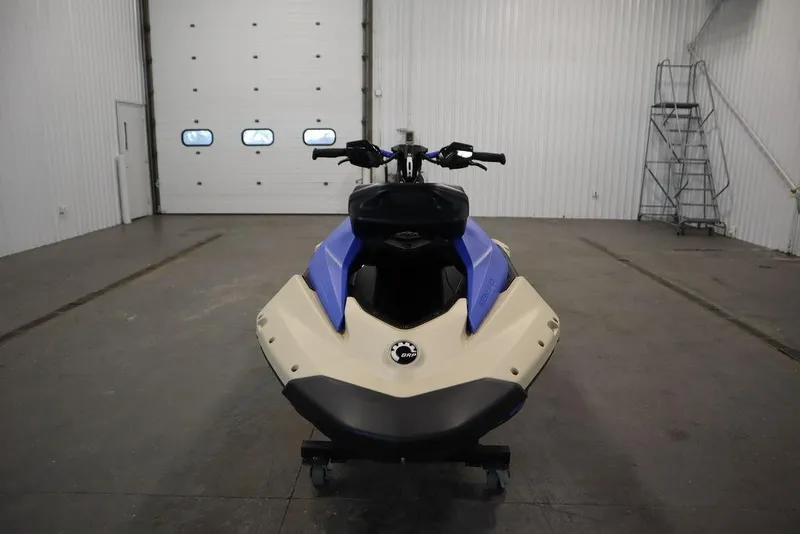 Slide: The Image of 2025 Sea-Doo Spark Trixx jet ski in a spacious indoor setting. - 12