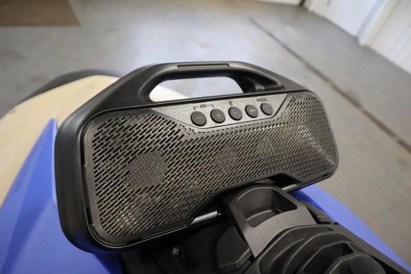 Slide: The Image of 2025 Sea-Doo Spark Trixx audio system with control buttons, close-up view. - 5