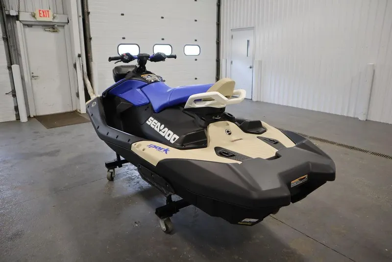 Slide: The Image of 2025 Sea-Doo Spark Trixx jet ski in a garage setting. - 7