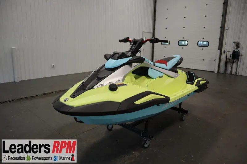 The Image of 2025 Yamaha WaveRunner JetBlaster PRO 3-Up in showroom, vibrant yellow and blue design. - 1