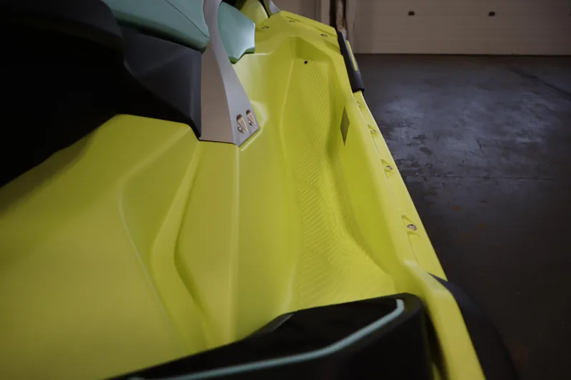 Slide: The Image of 2025 Yamaha WaveRunner JetBlaster PRO 3-Up, vibrant yellow side view in a garage setting. - 11