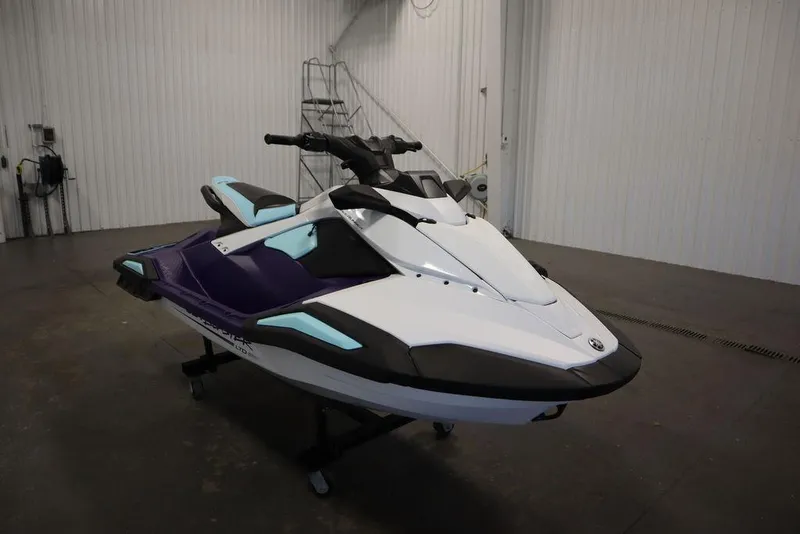 Slide: The Image of 2025 Yamaha WaveRunner JetBlaster LTD in a showroom, showcasing sleek design and vibrant colors. - 2