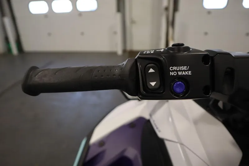 Slide: The Image of 2025 Yamaha WaveRunner JetBlaster LTD handlebars in a garage setting. - 22