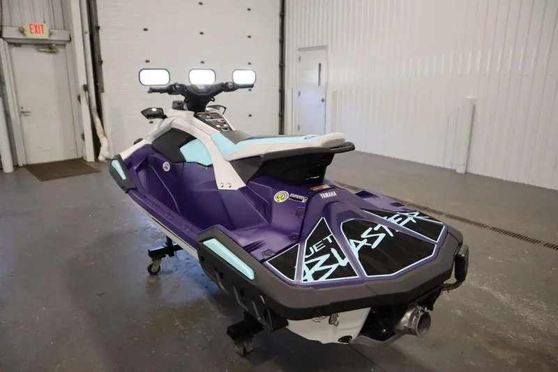 Slide: The Image of 2025 Yamaha WaveRunner JetBlaster LTD in a garage, rear view. - 29