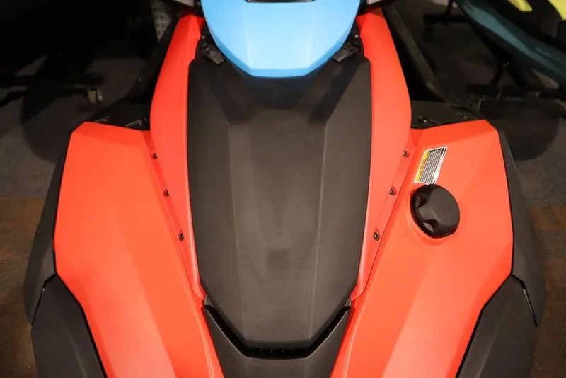 Slide: The Image of 2025 Yamaha WaveRunner JetBlaster DLX 3-Up, red and black design, top view. - 11