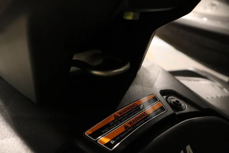 Slide: The Image of Close-up of 2025 Yamaha WaveRunner JetBlaster DLX 3-Up warning label and handle detail. - 15
