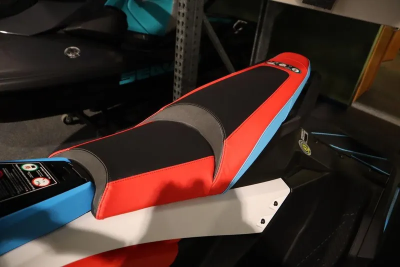 Slide: The Image of 2025 Yamaha WaveRunner JetBlaster DLX 3-Up seat, featuring vibrant red and black design. - 16