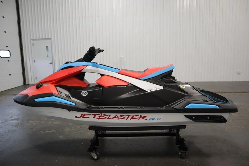 Slide: The Image of 2025 Yamaha WaveRunner JetBlaster DLX 2-Up in vibrant red and blue, displayed indoors. - 8