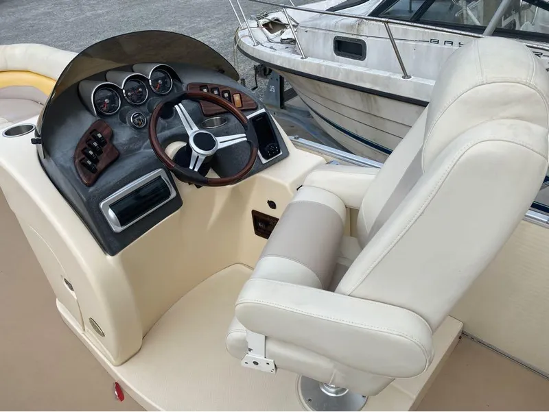 Slide: The Image of Godfrey AP 240 boat dashboard and captain's chair, 2012 model. - 5