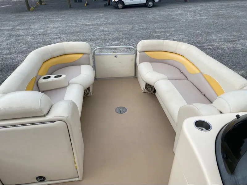 Slide: The Image of 2012 Godfrey AP 240 pontoon boat interior with beige and yellow seating. - 6