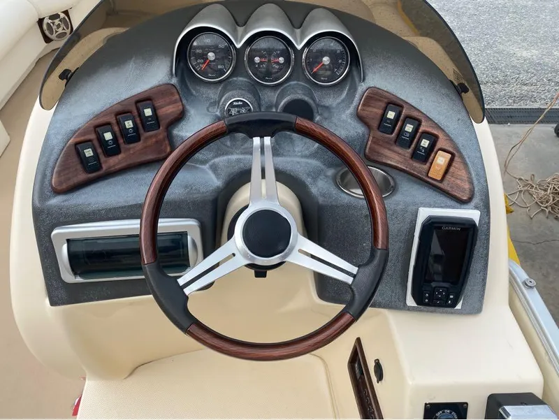 Slide: The Image of Godfrey AP 240 boat dashboard with steering wheel and control panel, 2012 model. - 7