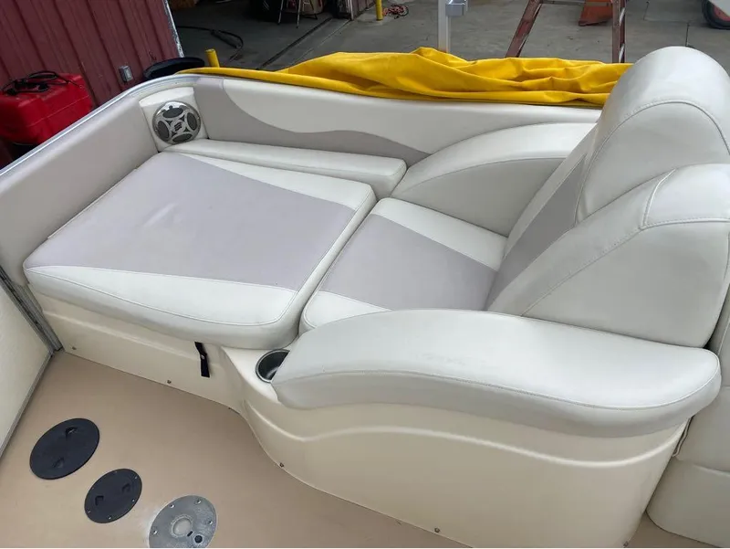 Slide: The Image of 2012 Godfrey AP 240 boat interior with white cushioned seating. - 8