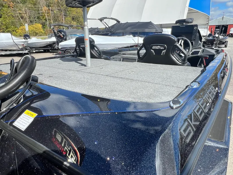 Slide: The Image of 2025 Skeeter FXR21 LE boat with sleek design and spacious deck. - 13