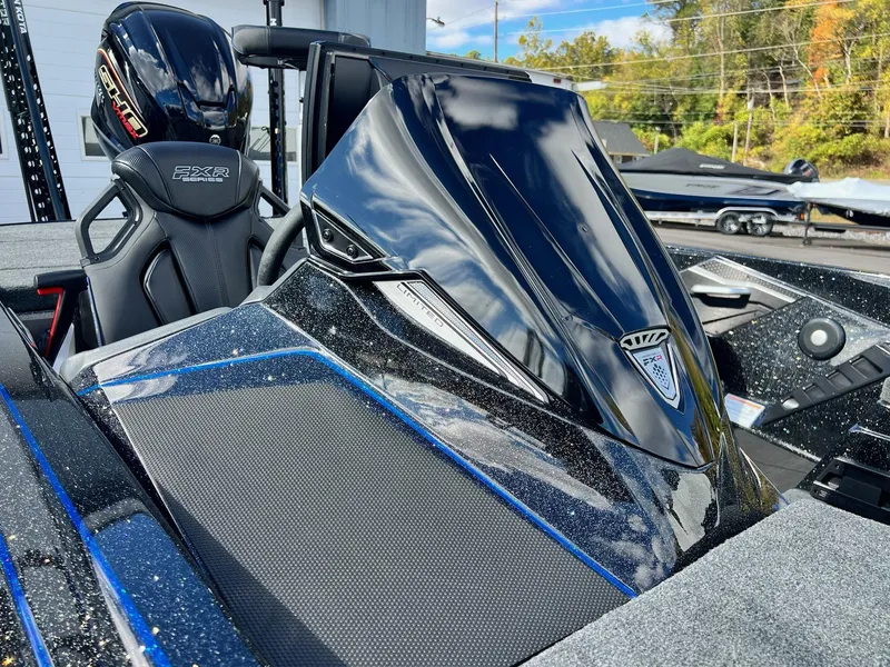 Slide: The Image of 2025 Skeeter FXR21 LE boat with sleek design and powerful engine. - 17