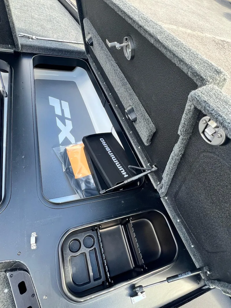 Slide: The Image of 2025 Skeeter FXR21 LE boat storage compartment with Humminbird electronics. - 22