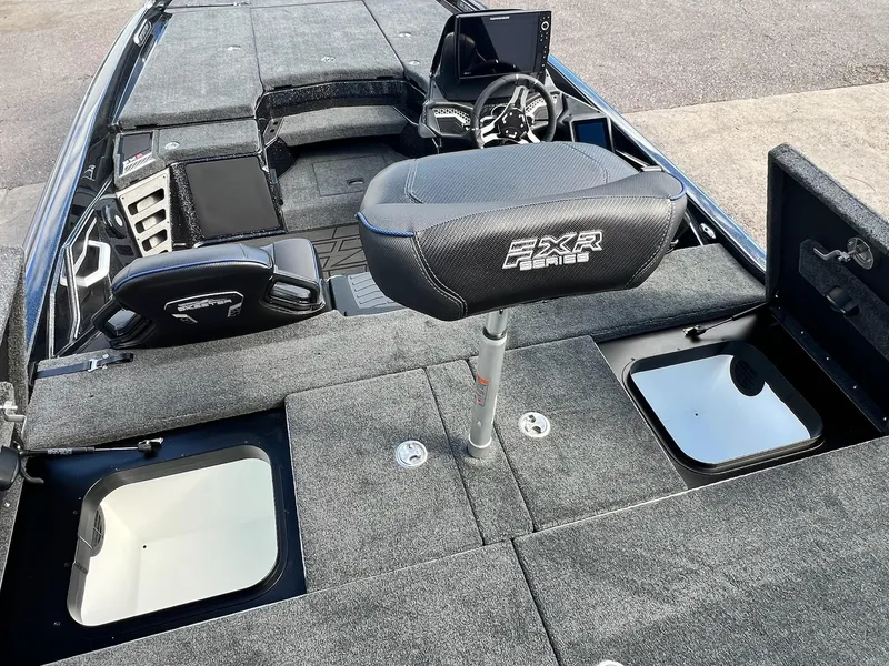 Slide: The Image of 2025 Skeeter FXR21 LE boat interior with advanced seating and control panel. - 39