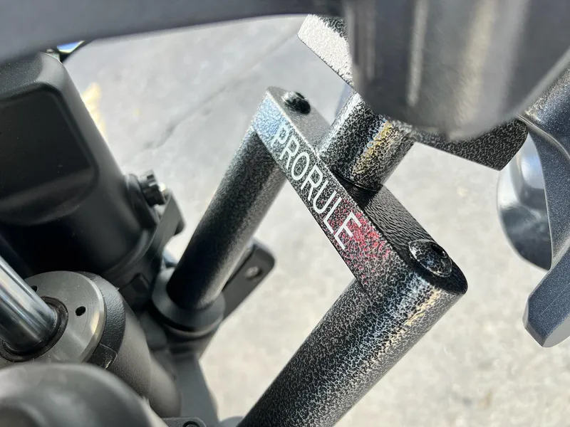 Slide: The Image of Close-up of 2025 Skeeter FXR21 LE ProRule component, showcasing textured metal finish. - 43