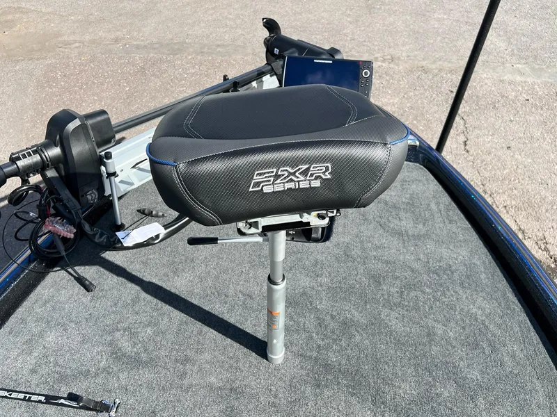 Slide: The Image of 2025 Skeeter FXR21 LE boat seat on carpeted deck, featuring FXR Series branding. - 44