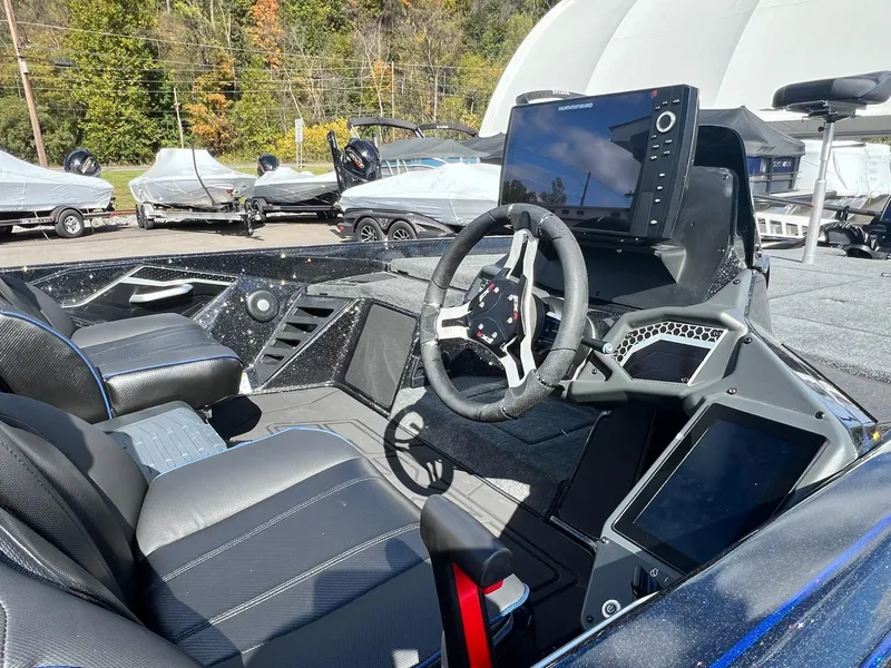 Slide: The Image of 2025 Skeeter FXR21 LE boat interior with advanced navigation system and sleek design. - 47