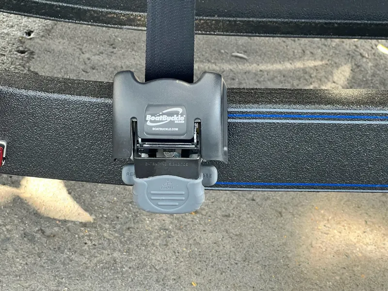 Slide: The Image of BoatBuckle strap on 2025 Skeeter FXR21 LE trailer, close-up view. - 7