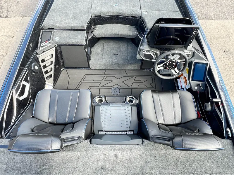 Slide: The Image of 2025 Skeeter FXR21 LE boat interior with dual seats and advanced dashboard. - 8