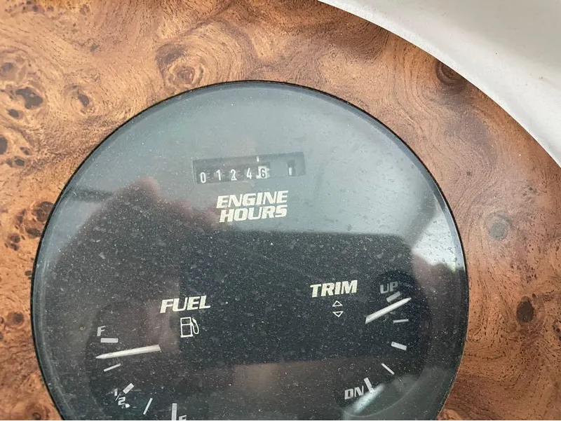 Slide: The Image of 1996 Celebrity 220 dashboard showing engine hours, fuel, and trim gauges. - 10