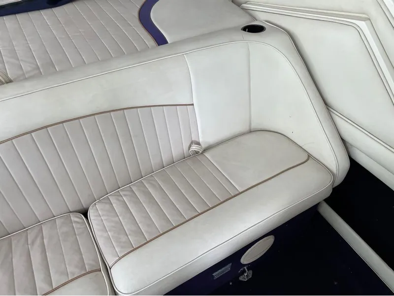 Slide: The Image of White leather boat seating in a 1996 Celebrity 220 model. - 16