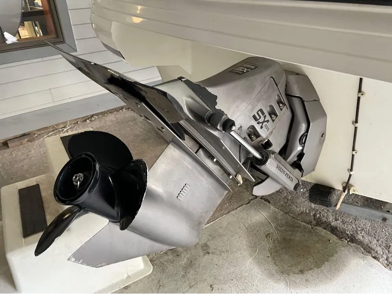 Slide: The Image of Volvo Penta SX outdrive on 1996 Celebrity 220 boat, close-up view. - 19