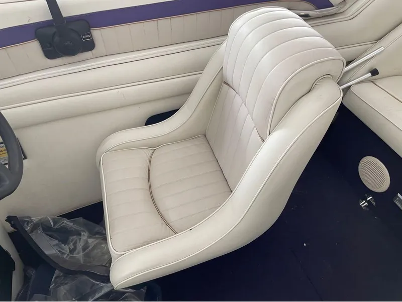 Slide: The Image of White leather seat in a 1996 Celebrity 220 boat interior. - 21