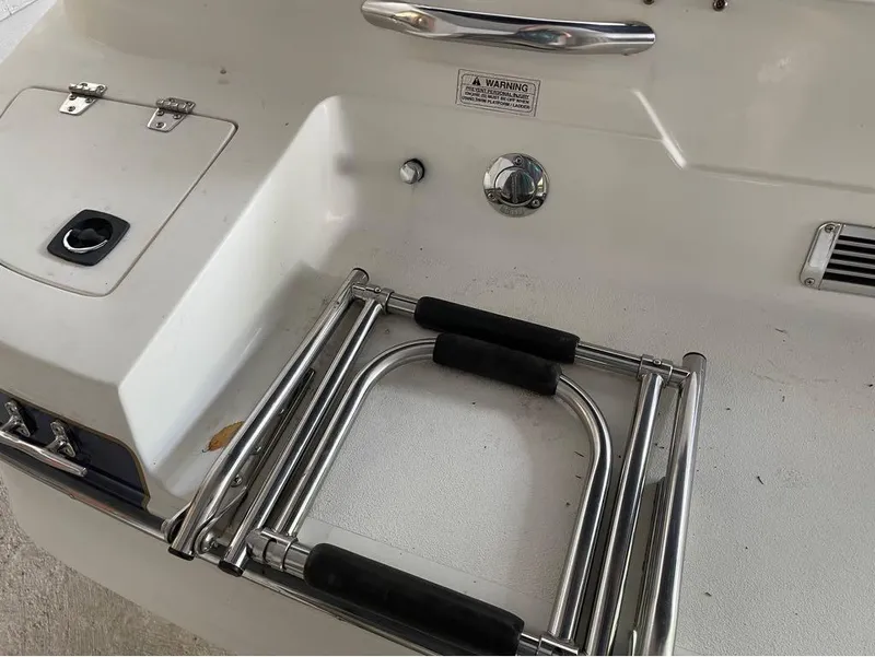 Slide: The Image of Stainless steel boat ladder on a 1996 Celebrity 220 deck. - 3