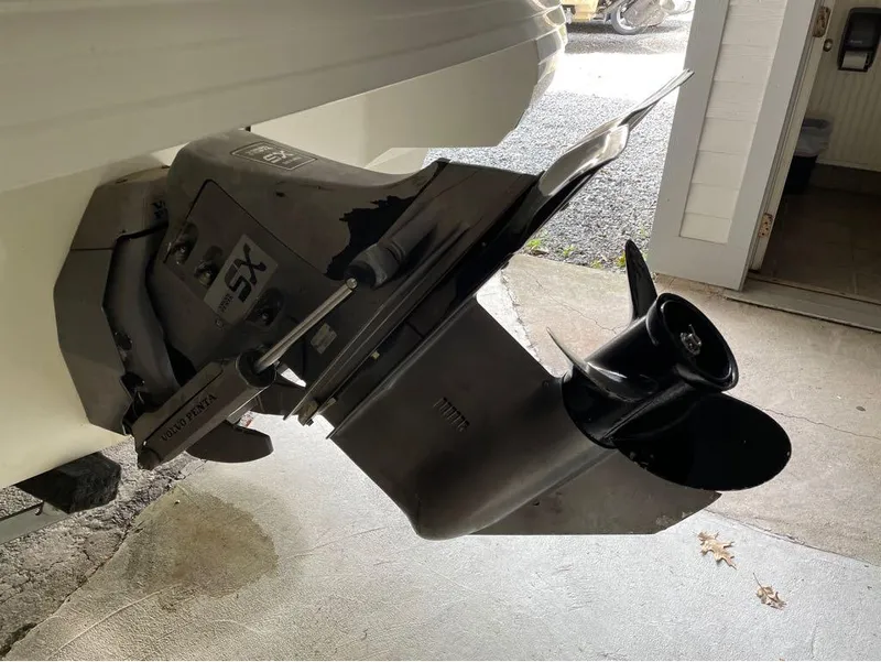 Slide: The Image of 1996 Celebrity 220 boat with Volvo Penta SX outdrive in garage. - 5