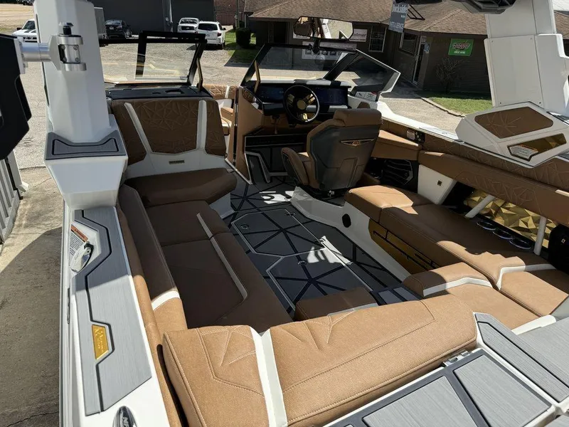 Slide: The Image of Luxurious interior of 2025 Nautique PARAGON 23 boat with brown seating and modern design. - 12